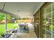 Inviting covered patio with outdoor seating and string lights, perfect for entertaining and relaxation with play area in the yard at 4012 S Newport Way, Denver, CO 80237