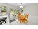 Bright breakfast nook with a wooden table and chairs, and access to the outdoor patio at 4012 S Newport Way, Denver, CO 80237