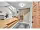 Welcoming entryway with wood flooring, an open staircase, and ample natural light at 4012 S Newport Way, Denver, CO 80237