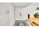 Bright foyer with double doors, tile flooring, and a modern security system at 4012 S Newport Way, Denver, CO 80237