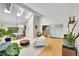 Spacious living area with soaring ceilings, wood floors, and modern decor at 4012 S Newport Way, Denver, CO 80237