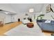 An open concept living room with vaulted ceilings, hardwood floors, and plenty of light at 4012 S Newport Way, Denver, CO 80237