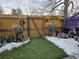 Cozy backyard with artificial turf, wooden fence, and garden decorations at 4211 E 94Th Ave # C, Thornton, CO 80229