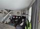 Living room with fireplace, stairs and hardwood floors at 4211 E 94Th Ave # C, Thornton, CO 80229