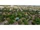 High aerial perspective of townhomes nestled among mature trees, with community pool at 9400 E Iliff Ave # 292, Denver, CO 80231