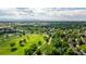 Scenic aerial view of neighborhood with golf course and city skyline in the distance at 9400 E Iliff Ave # 292, Denver, CO 80231