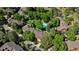 Aerial view of townhome community with mature trees and a community pool at 9400 E Iliff Ave # 292, Denver, CO 80231