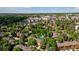 Aerial shot of townhome community showcasing lush landscaping and community pool at 9400 E Iliff Ave # 292, Denver, CO 80231