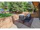Cozy brick patio with seating in the backyard at 9400 E Iliff Ave # 292, Denver, CO 80231