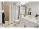 Bathroom featuring a shower-tub combo, white vanity, and neutral color scheme offering a clean, classic look at 9400 E Iliff Ave # 292, Denver, CO 80231