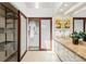 Well-lit bathroom with double sinks, a spacious closet, and a sliding glass door at 9400 E Iliff Ave # 292, Denver, CO 80231