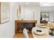 Cozy dining area featuring a stylish built-in cabinet and a glimpse into the bright, inviting living space at 9400 E Iliff Ave # 292, Denver, CO 80231