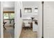 Hallway leads to a stylish sitting area, blending natural light with elegant interior design elements at 9400 E Iliff Ave # 292, Denver, CO 80231