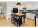 This renovated kitchen features white cabinets, modern appliances, an eat-in island, and updated finishes at 9400 E Iliff Ave # 292, Denver, CO 80231