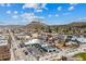 Picturesque aerial view captures the charming town center and its mountain backdrop in a vibrant, sunny setting at 109 Cantril St, Castle Rock, CO 80104