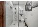 Modern bathroom showcasing a glass-enclosed shower with custom tile work, along with contemporary fixtures and decor at 6740 S Windermere St, Littleton, CO 80120