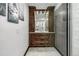 Beautiful bathroom with a glass enclosed shower, decorative backsplash, stylish vanity, and modern fixtures at 6740 S Windermere St, Littleton, CO 80120