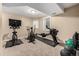Home gym with exercise equipment, weights and stationary bikes at 6740 S Windermere St, Littleton, CO 80120