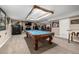 An amazing game room with a pool table, safe, custom lighting and a mounted flat screen TV at 6740 S Windermere St, Littleton, CO 80120