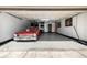 Attached garage featuring a vintage car, overhead lighting, and ample storage at 6740 S Windermere St, Littleton, CO 80120