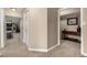 A hallway featuring a storage closet and entryways to other rooms, highlighting easy access and flow throughout the home at 6740 S Windermere St, Littleton, CO 80120