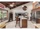 Spacious kitchen with granite countertops, stainless steel appliances and exposed wooden beams at 6740 S Windermere St, Littleton, CO 80120