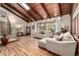 Spacious living room featuring hardwood floors, wooden ceilings, a staircase, and comfortable seating at 6740 S Windermere St, Littleton, CO 80120