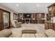 Cozy living room with stone fireplace, custom wood built-ins, and comfortable seating at 6740 S Windermere St, Littleton, CO 80120