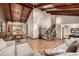 Bright living room with vaulted ceilings, hardwood floors, a dining area, and a staircase at 6740 S Windermere St, Littleton, CO 80120