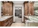 Luxurious bathroom with double vanity, stone countertop, and neutral color palette at 6740 S Windermere St, Littleton, CO 80120