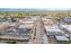 Street-level aerial view of a bustling city with rows of buildings, traffic-lined streets, and vibrant urban life at 6740 S Windermere St, Littleton, CO 80120