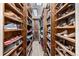 A well-organized walk-in closet with custom shelving, providing ample storage for clothes, shoes and accessories at 6740 S Windermere St, Littleton, CO 80120