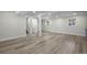 Large basement with plenty of natural light, modern floors, and open layout, perfect for entertaining or relaxing at 11877 Keough Dr, Northglenn, CO 80233