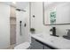 Modern bathroom with sleek fixtures, including a stylish vanity, contemporary sink, and glass-enclosed shower with mosaic accents at 11877 Keough Dr, Northglenn, CO 80233
