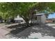Charming home featuring a well-maintained exterior, mature trees, and a welcoming driveway leading to the property at 11877 Keough Dr, Northglenn, CO 80233