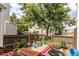 Private fenced backyard featuring a dining area, landscaping, and a play slide at 19807 Victorian Way, Parker, CO 80138