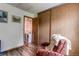 Bedroom featuring hardwood floors, a closet, and a comfortable chair at 19807 Victorian Way, Parker, CO 80138