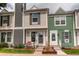 Inviting townhome exterior showcasing a cozy entrance and manicured landscaping at 19807 Victorian Way, Parker, CO 80138