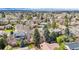 Neighborhood aerial shot showcasing the property among mature trees and other homes at 3722 S Quebec St, Denver, CO 80237