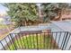A fenced backyard featuring a well-maintained lawn and a storage shed at 3722 S Quebec St, Denver, CO 80237