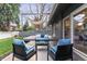 Relaxing backyard deck with comfortable seating and decorative shade sail at 3722 S Quebec St, Denver, CO 80237
