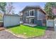 View of the charming backyard with a well-maintained lawn and shed perfect for outdoor storage at 3722 S Quebec St, Denver, CO 80237