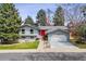 Charming two-story home with blue paint, bright red front door, and well-maintained landscaping at 3722 S Quebec St, Denver, CO 80237