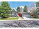 Charming two-story home with blue paint, bright red front door, and well-manicured lawn at 3722 S Quebec St, Denver, CO 80237