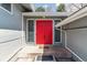 Inviting front entrance with a bright red double door and modern sidelights at 3722 S Quebec St, Denver, CO 80237
