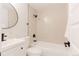 Modern bathroom with clean lines, featuring a shower-tub combo and sleek black fixtures at 6285 S Oneida Way, Centennial, CO 80111