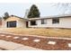 Attractive home showcasing modern design, a well-kept lawn and meticulous landscaping at 6285 S Oneida Way, Centennial, CO 80111