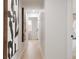 Bright hallway featuring modern decor and leading to other rooms of the home at 6285 S Oneida Way, Centennial, CO 80111