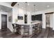 Charming bar area featuring wood accents, stylish lighting and views to the bath, adding to the home's cozy and modern design at 8310 Raphael Ln, Littleton, CO 80125