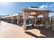 Relaxing outdoor seating area with shaded cabanas, comfortable lounge chairs, and scenic views at 8310 Raphael Ln, Littleton, CO 80125